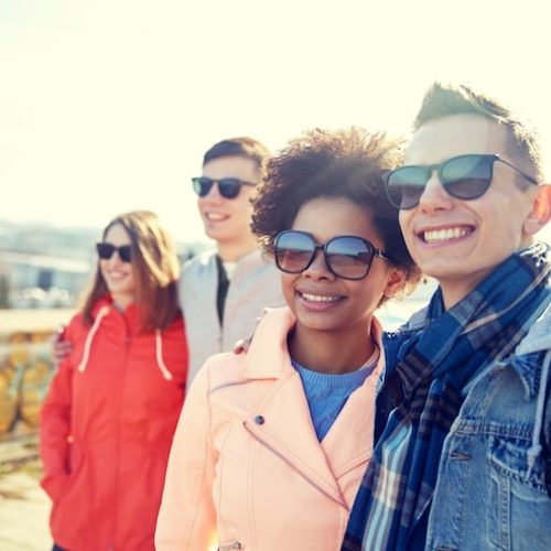tourism-travel-people-leisure-teenage-concept-group-smiling-teenagers-sunglasses-hugging-city-street_380164-138450 (1)
